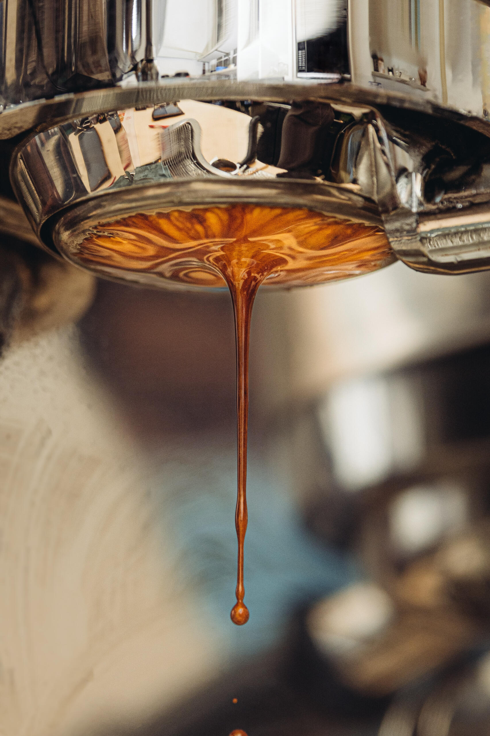 espresso dripping from an espresso machine